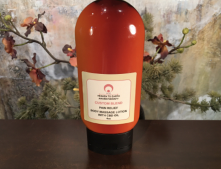 bottle of cbd massage oil by H2E Aromatherapy