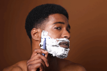Black man using Mancave Blend Shaving Cream